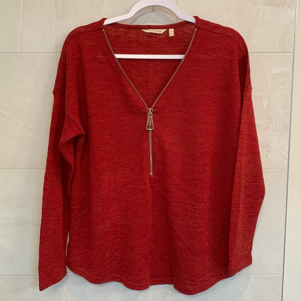 Burnt orange long sleeve shirt with zipper detailing for v neck, zipper moves